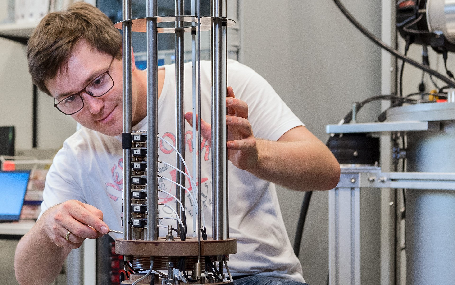 Andreas Wendl preparing a superconducting magnet system.
