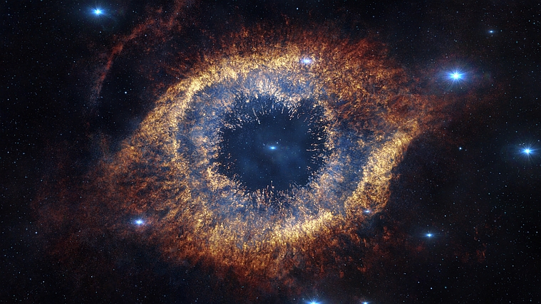 An infrared image of the Helix Nebula taken by a telescope of ESO, a partner in the ORIGIN cluster of excellence.