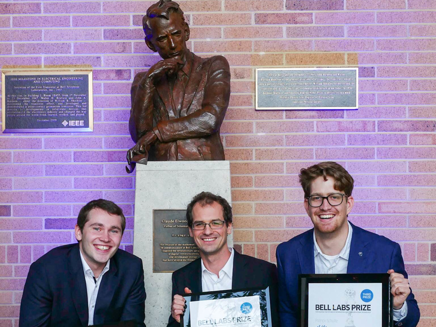 TUM researchers (l-r) Fabian Steiner, Georg Böcherer, and Patrick Schulte with the statue of Claude Shannon, father of information theory. (Image: Denise Panyik-Dale/Alcatel-Lucent)