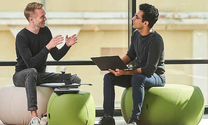 Members of a founding team in conversation.