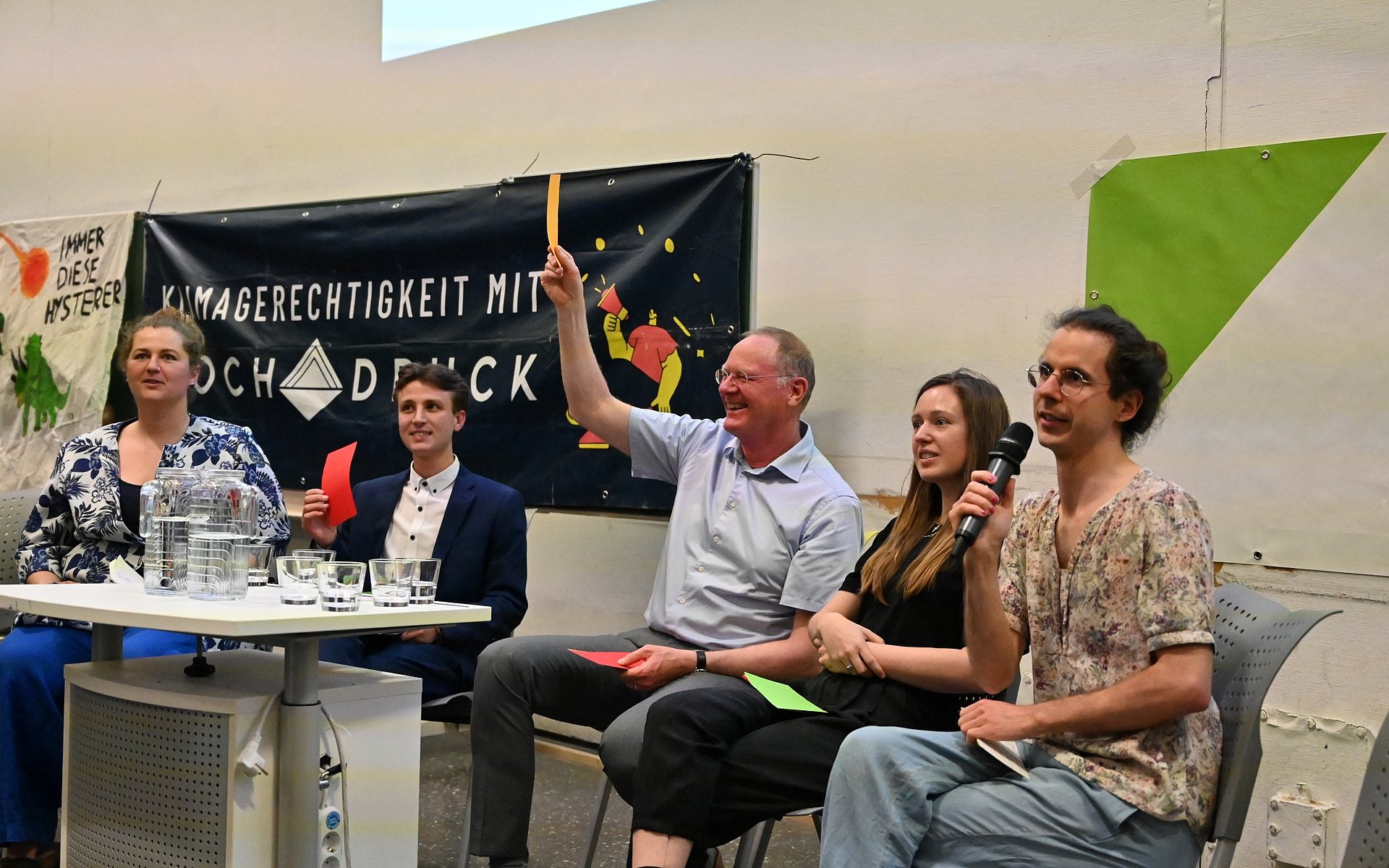 Elias Singer, Werner Lang, Lucia Layritz, and the moderation team at the fishbowl discussion on the role of universities in climate crisis.