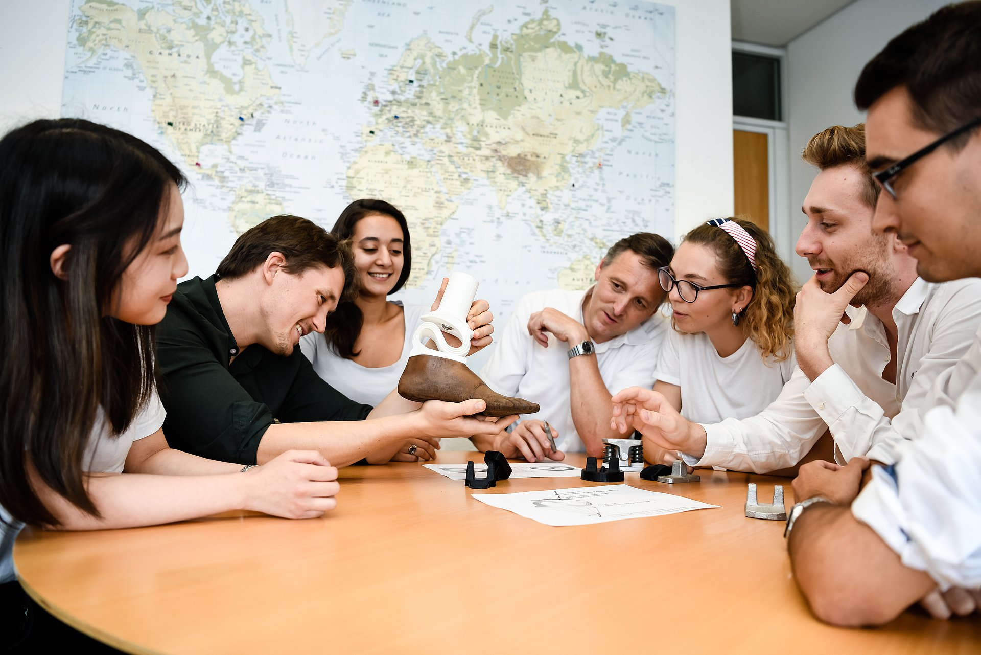 People eye a foot prosthesis