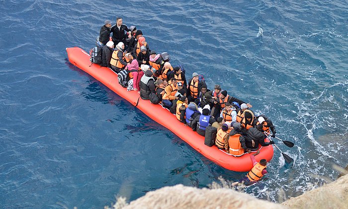People in a rubber dhingy.