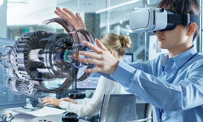 Man with virtual-reality glasses designig a turbine.