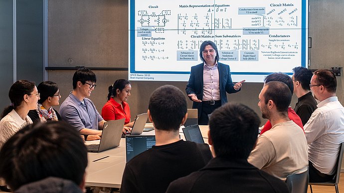 A professor with students in a lesson.