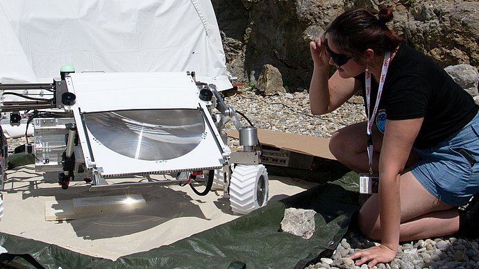 TUM student Laura Bauer with rover LARSS