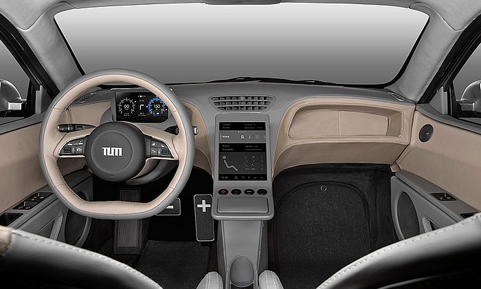 A central screen provides driving information. With simple swiping gestures the driver can enter commands on a touch pad (right). – Photo: Florian Lehmann / TUM