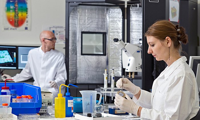 Two young researchers in a laboratory.