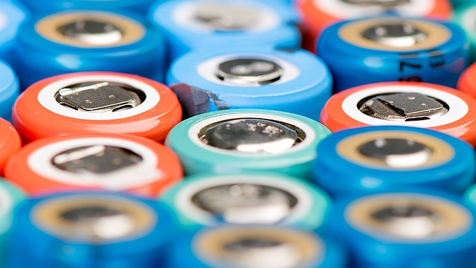 The picture shows Lithium-ion batteries in different colours.