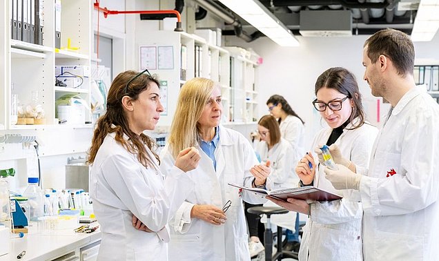 Aphrodite Kapurniotu and her team in the laboratory