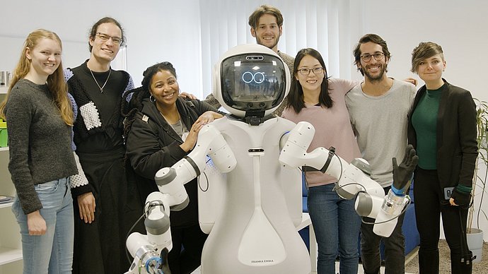 Students of the "Responsible Robotics" team together with the assistant robot MIRMI at the Project Weeks 2023.