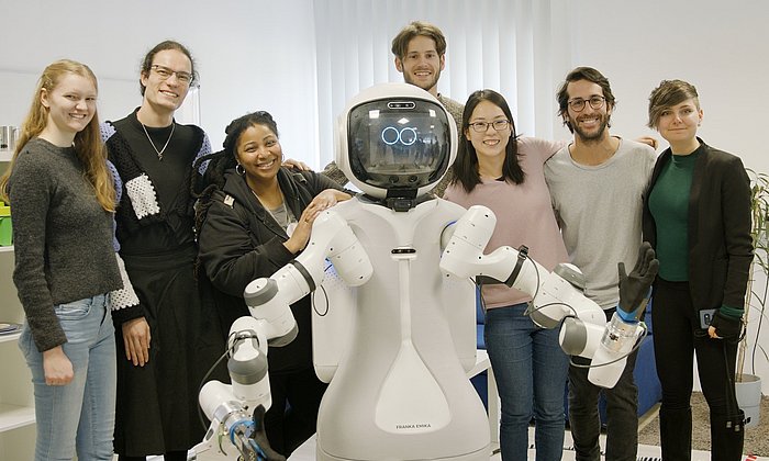 Students of the "Responsible Robotics" team together with the assistant robot MIRMI at the Project Weeks 2023.