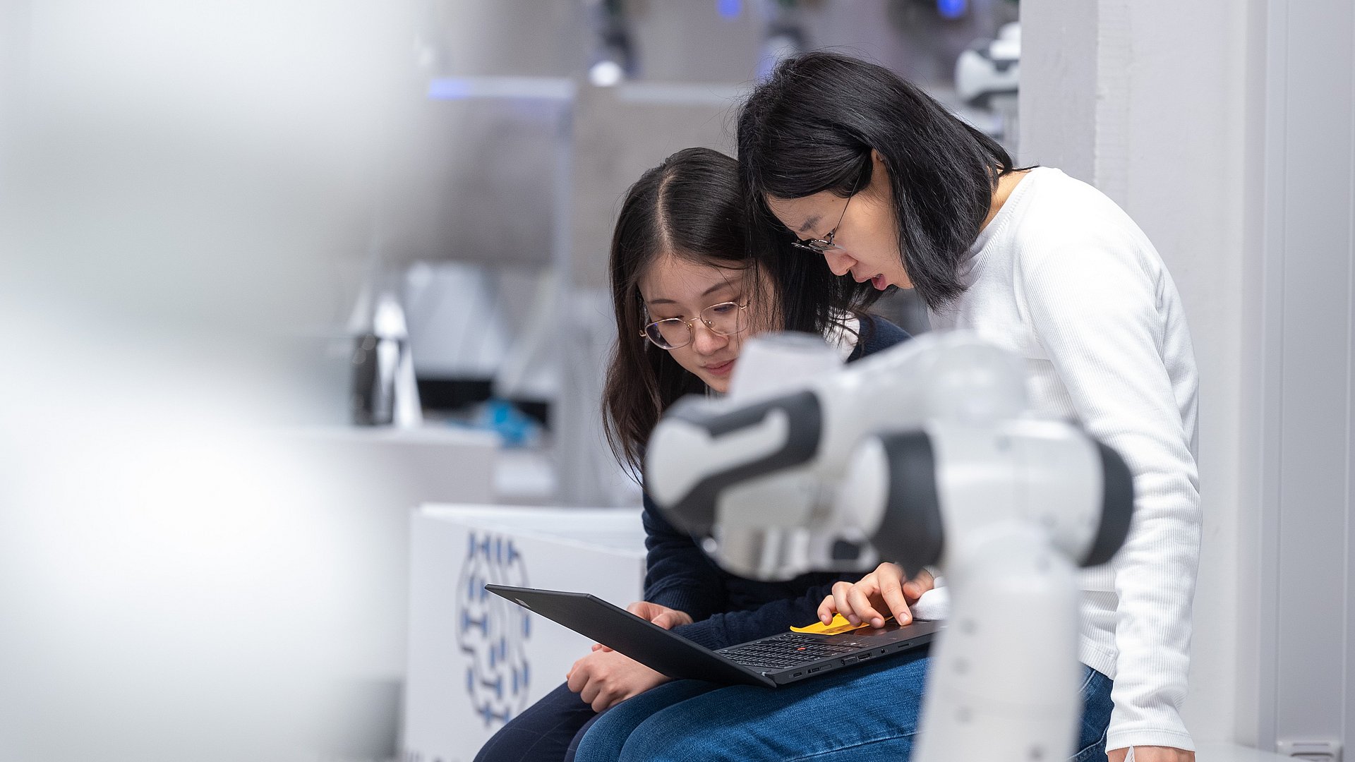 Doctorate Kejia Chen is discussing results with her colleague Jingyun Zhao.