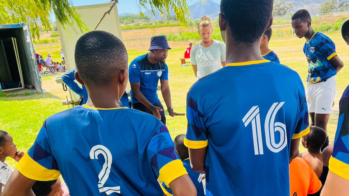 Christopher Chvalina with football students during training.