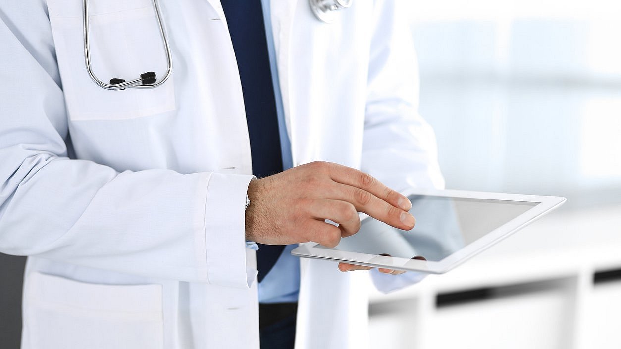 Doctor with tablet computer