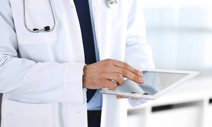 Doctor with tablet computer