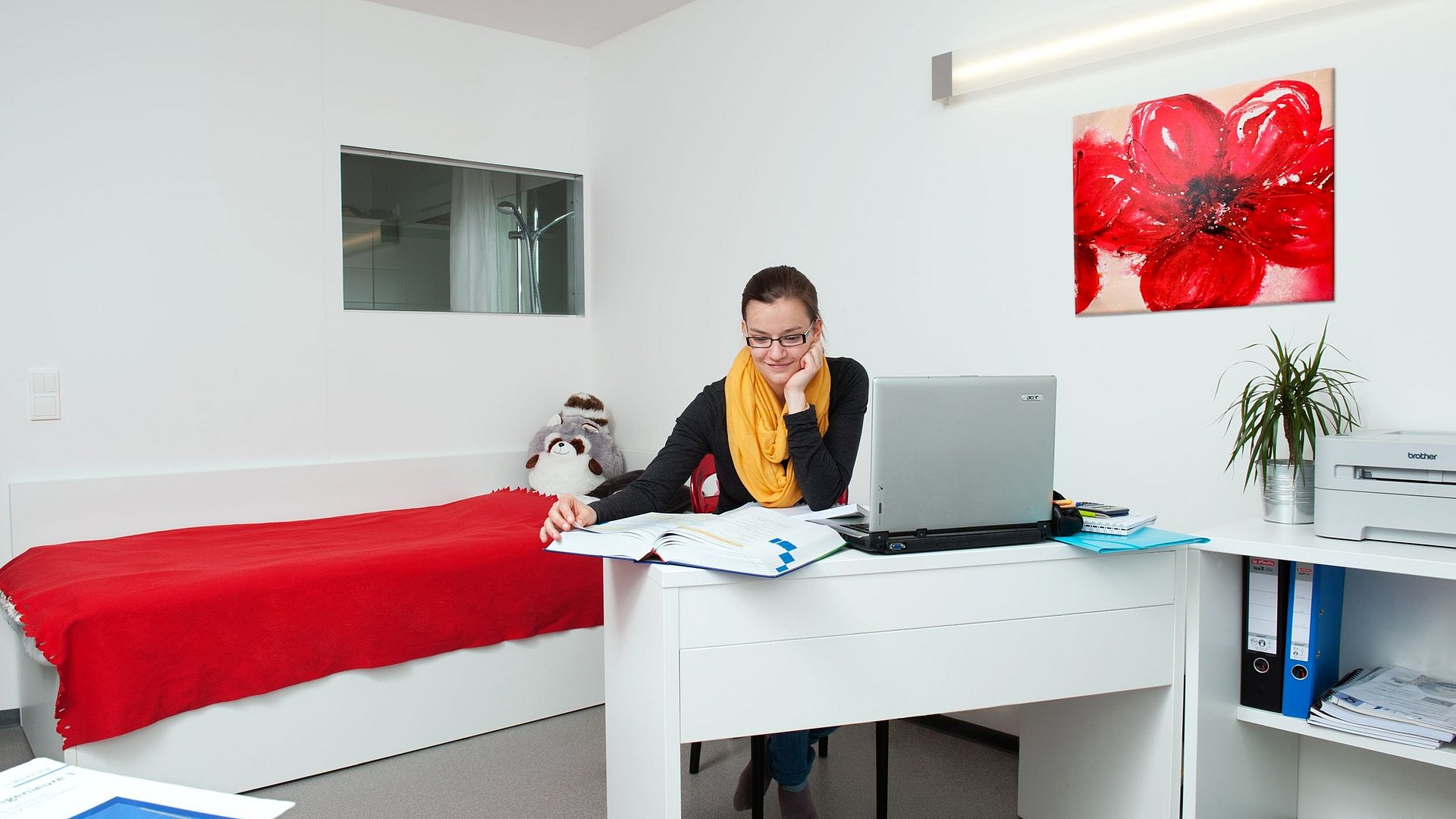 A student n her student room in the "Apian-Studenten-Apartment-Haus" (Student residence) in Unterföhring.