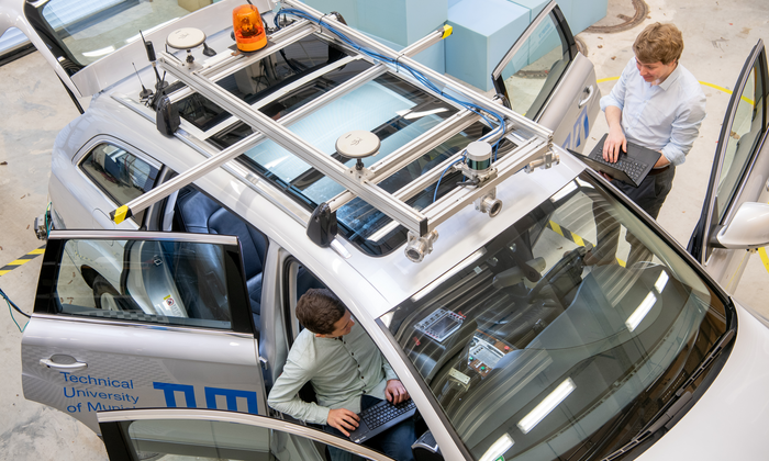 Researchers working on autonomous vehicle