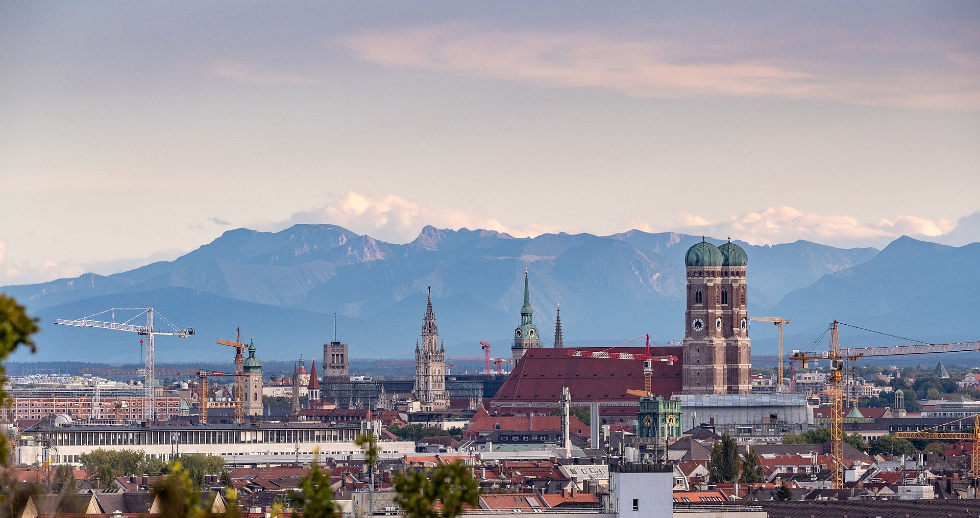 Shot of the city of Munich from above with a panorama of the Alps in the background