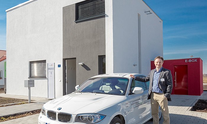 Prof. Franz Hagn in front of the energy-plus house in Hallbergmoos.