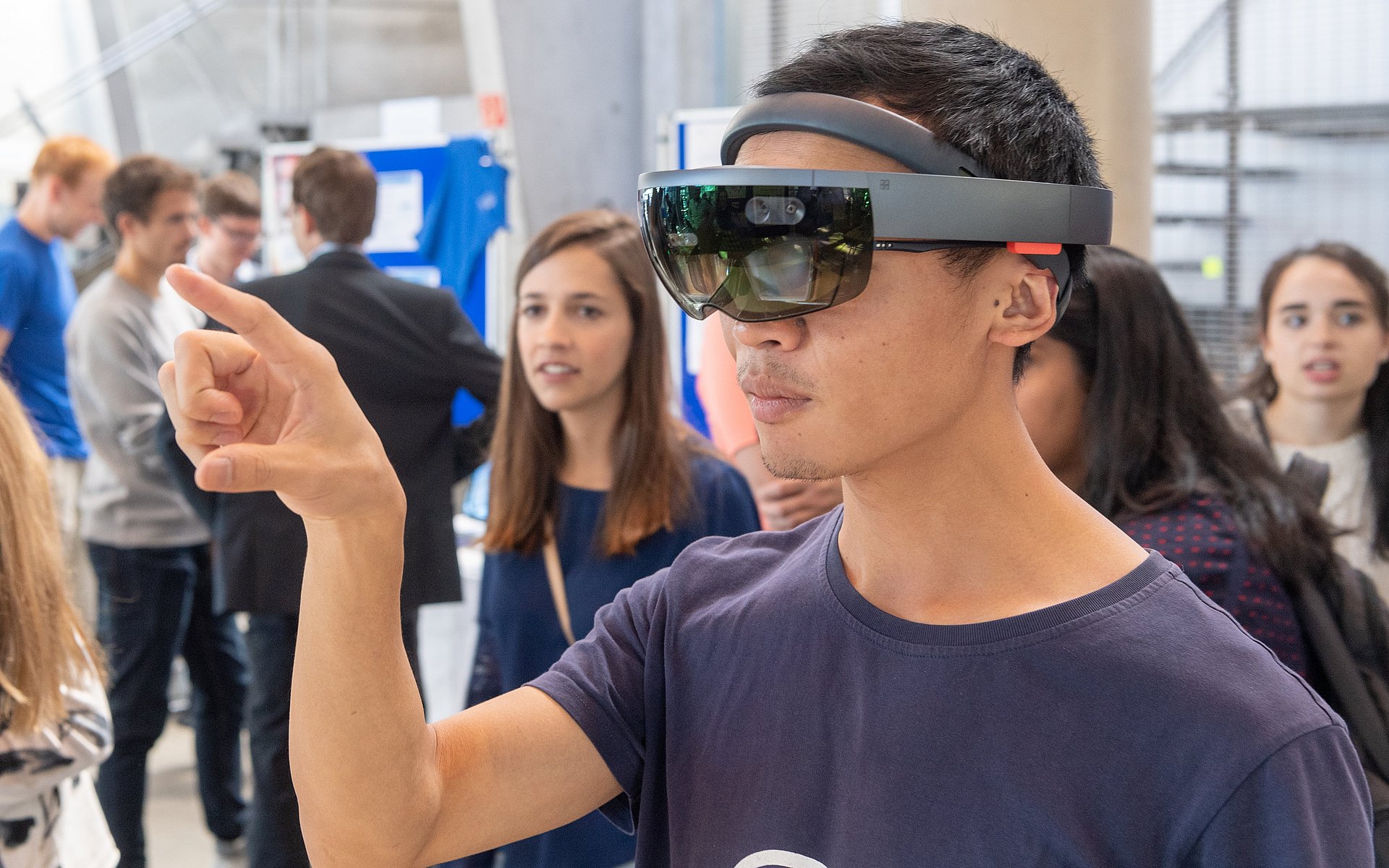 isitor wearing 3D glasses at Open-door Day of Technical University of Munich in 2013.