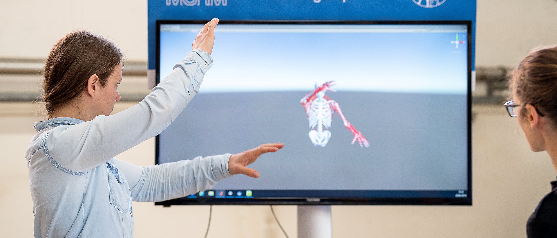 Researchers testing a digital twin at a screen.