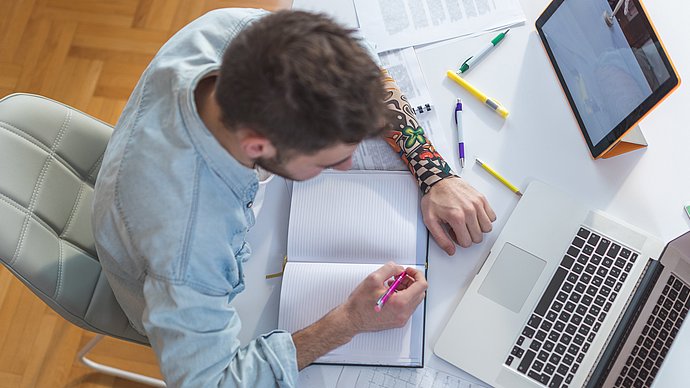 Student with laptop and tablet computer