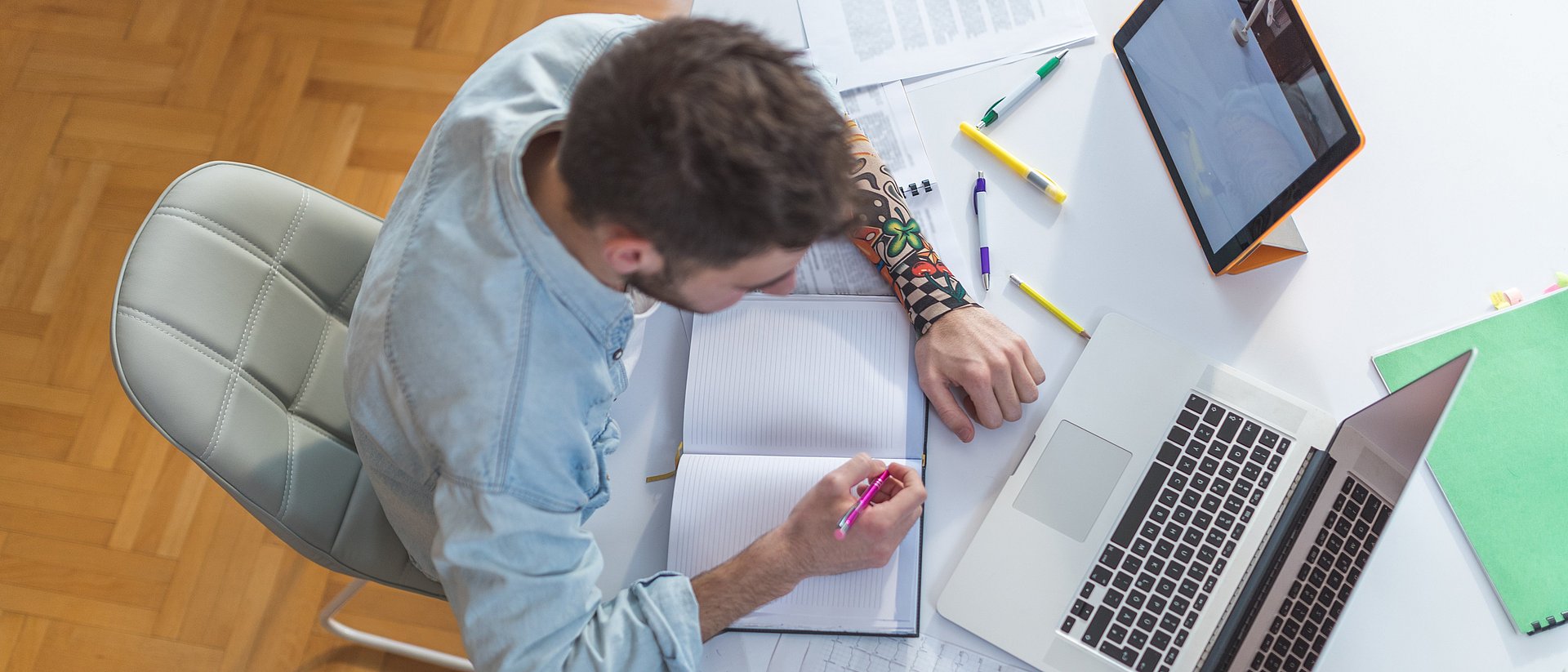 Student with laptop and tablet computer