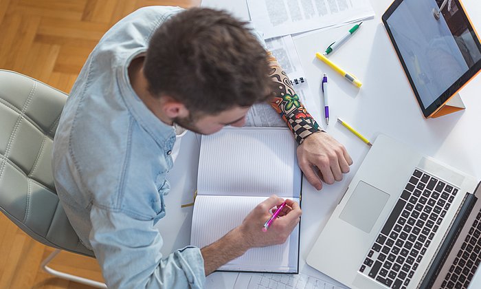 Student with laptop and tablet computer