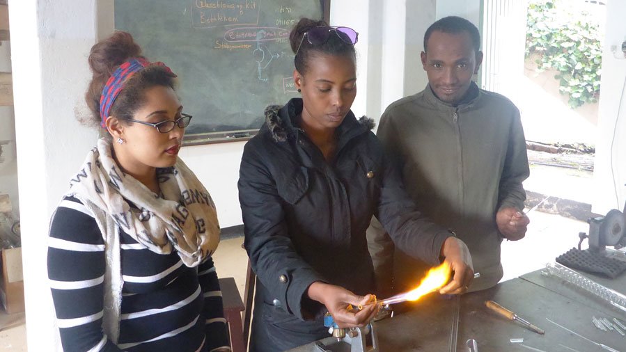 At the University of Addis Ababa, interns practice the first steps of glass apparatus construction. (Photo: private)