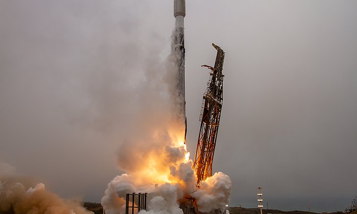 A rocket takes off in the fog