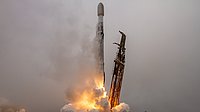A rocket takes off in the fog