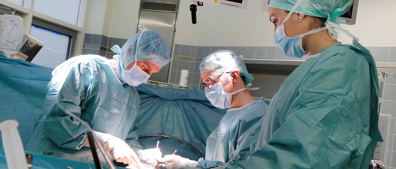 Medical doctors operating on a surgery.