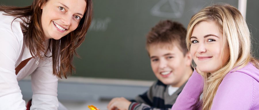 Teacher with two school students