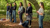 Participants taking part in a soundwalk at one of the listening stations