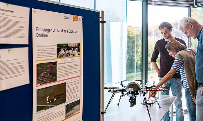 Visitors view a drone