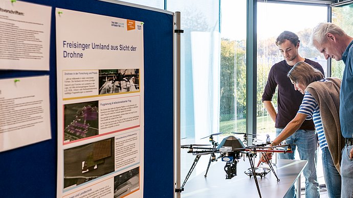 Visitors view a drone