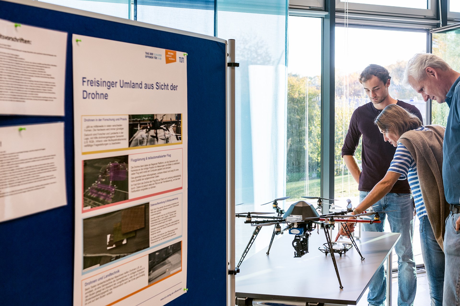 Visitors view a drone