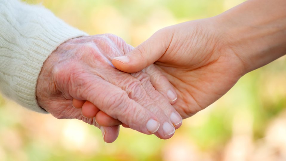 Two hands holding each other Two hands holding each other