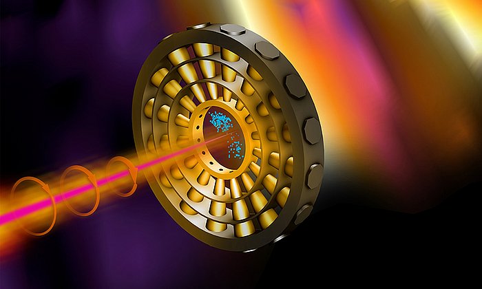 Titelbild der April-Ausgabe von Nature Photonics: Ultrakurze Röntgenpulse (rosa) ionisieren Neongas im Zentrum des Rings. Ein Infrarotlaser (orange) lenkt die Elektronen (blau) auf ihrem Weg zu den Detektoren ab. (Bild: Terry Anderson / SLAC National Accelerator Laboratory)