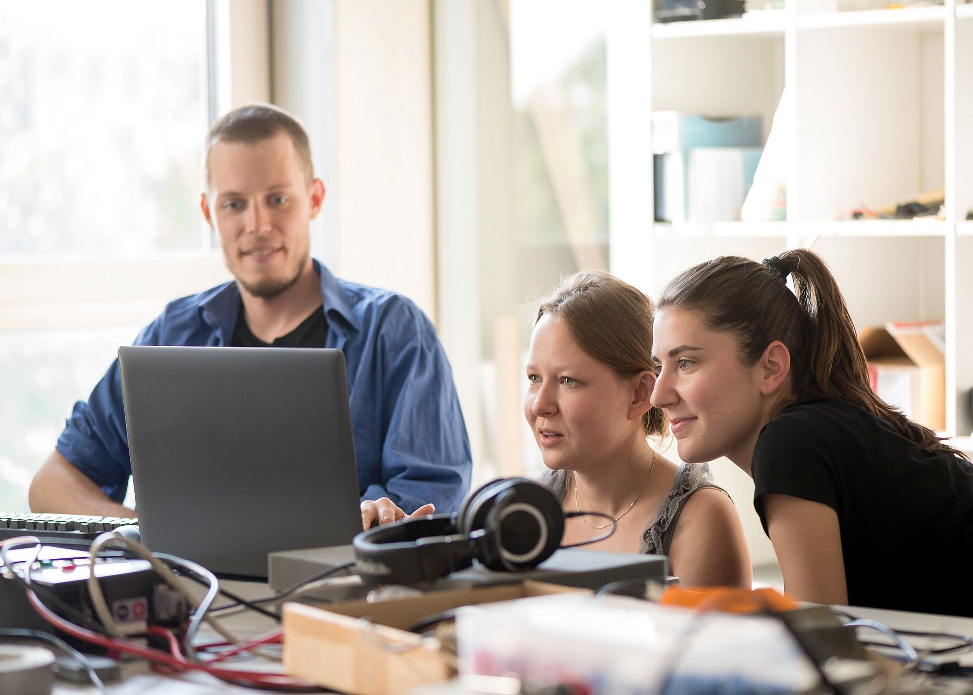 Members of the start-up KEWAZO in their workspace at the Incubator of the Entrepreneurship Center of the Technical University of Munich (TUM), working on their prototype of a scaffolding robot