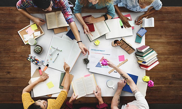 Young people at a classroom table