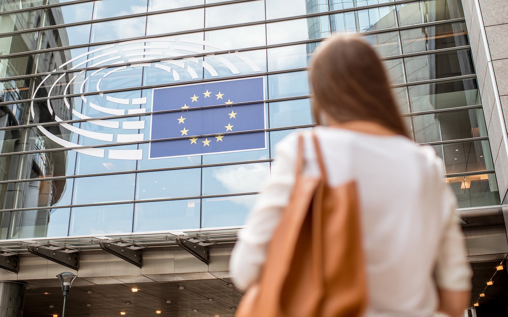 A woman infront of the European Parliament