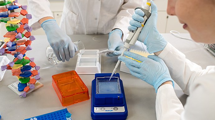 A woman working with biotech equipment