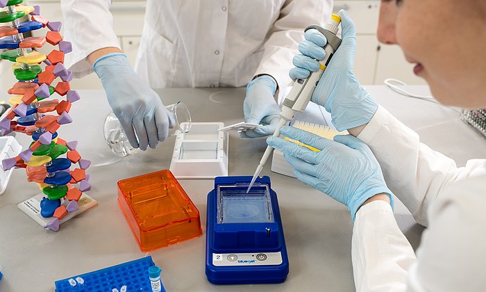 A woman working with biotech equipment