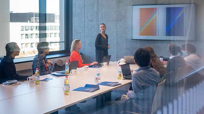 Students and researchers in a lecture room