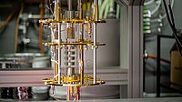The image shows the cooling structures of an open quantum computer.