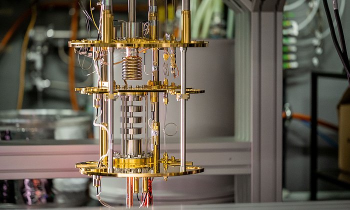 The image shows the cooling structures of an open quantum computer.