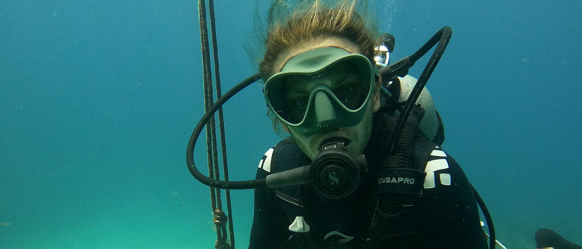 Christopher Chvalina in diving gear under water 