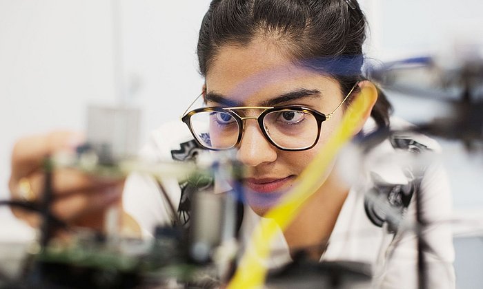 Scientist working on a hybrid simulator.